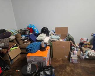 Chaise lounge, clothes, sheets, kerosene heater