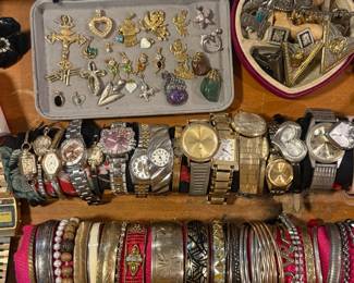 Gold charms and vintage watches, bangles