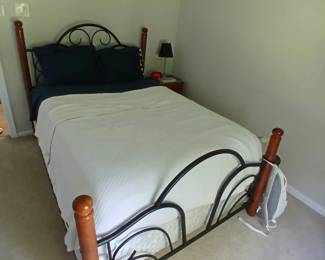 BLACK METAL AND MAHOGANY STAINED DOUBLE BED FRAME