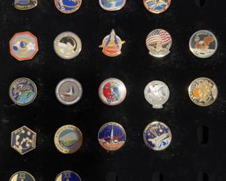 NASA mission pins, including Mercury, Gemini, Apollo, Skylab, Apollo-Soyuz, and Space Shuttle