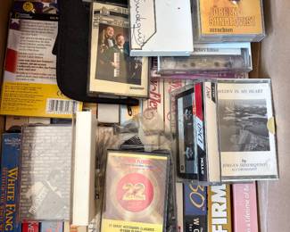 Assorted cassettes and VHS tapes