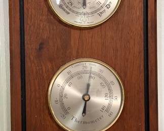 Vintage Cubic Corporation wall weather station featuring a barometer, thermometer, and hygrometer in a handsome wood case with brass-tone dials. Made in England