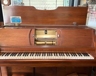Duo-Art reproducing player piano by Aeolian featuring the renowned Duo-Art expression system. This elegant upright player piano plays both standard piano rolls and Duo-Art reproducing rolls that recreate the touch and expression of famous pianists. Finished in a warm wood cabinet with original brass-finished player mechanism and keyboard in very nice condition. A wonderful instrument for collectors of mechanical music, player pianos, or vintage home furnishings. Includes an assortment of piano rolls (sold separately unless noted). Untested; buyers should inspect and verify operation.