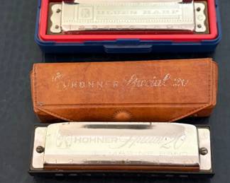 Vintage Harmonica Collection featuring several German-made Hohner harmonicas including Special 20 Marine Band models, Echo Harp, Chromonica in original wood case, Hohner Great Little Harp with box, and a Suzuki SU-24 tremolo harmonica