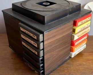 Vintage 8-track tape collection with multiple storage cases, featuring classic country, pop, rock, jazz, easy listening, soul, and soundtrack albums. Includes artists such as Frank Sinatra, Tony Bennett, John Denver, Sonny & Cher, Elton John, Funkadelic, Linda Ronstadt, Mel Tillis, Diana Ross, Tony Orlando & Dawn, and more. Also includes several 8-track carrying/storage cases filled with tapes