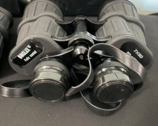 Binolux 7x50 fully coated binoculars with neck strap and protective lens caps. Full-size binoculars ideal for birdwatching, boating, sporting events, and outdoor use. Includes original carrying case.