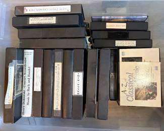 Large collection of VHS tapes and recorded media, including commercial movies, classical music, accordion concerts, instructional videos, Disney titles, home recordings, and numerous blank Maxell, TDK, and other premium VHS cassettes. Includes recordings of accordion performances, concerts, television broadcasts, and music programs, plus storage sleeves and cases