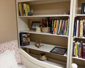 Three off white shelves and contents