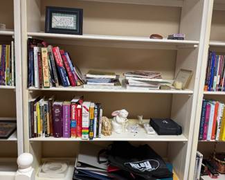 Three white sectional wall shelves,