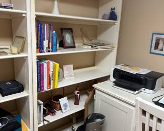 Three white sectional wall shelves