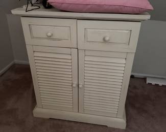 White double door shutter style storage cabinet