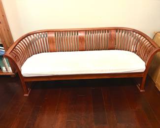Exceptional slatted back teak sofa