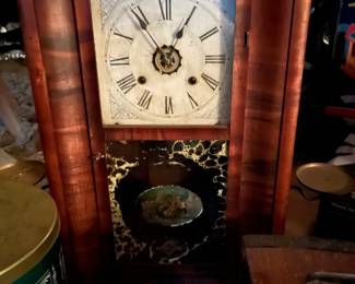 Antique wall clock with candle platforms
