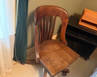 #62 - $100 -Antique oak swivel chair on caster