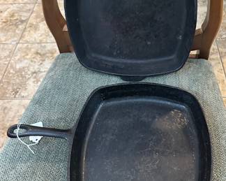 several square iron skillets
