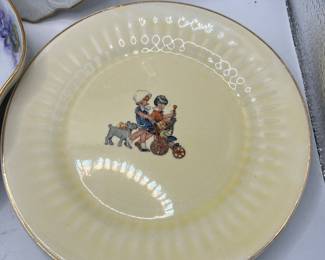 Crown Pottery dish depicting a young girl pushing a stroller while accompanied by a small terrier dog
