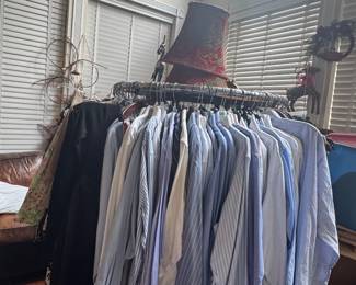 Size large, extra large, and size 40 shorts and pants and 17-1/2 dress shirts. Lots of men clothing on this rack. 