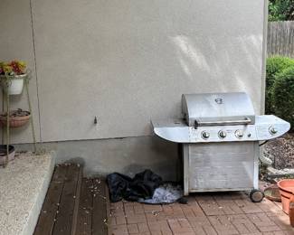propane gas grill, pots and plant stands and hooks