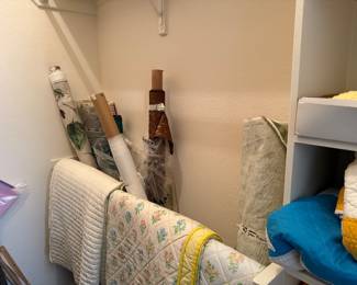 Fabric on bolts as well as other fabric and trim in room