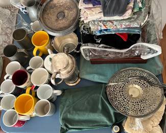 Assorted mugs, scarves, and more