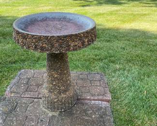 Conglomerate stone bird bath.