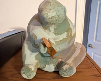 Seated Figure with Leaf Sculpture