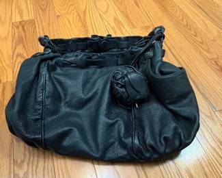 Black Leather Hobo Bag with Drawstring Closure and Rosette Detail