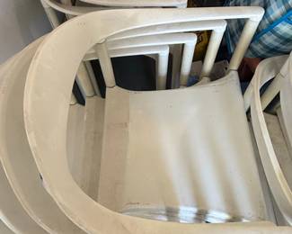 White Molded Plastic Stackable Armchairs each third image