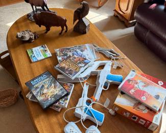 Wii console, controllers, games, figurines, coffee table