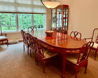 Rosewood Dining Room Set with 3 leaves and 10 chairs!  This can also be a round table once all the leaves are removed. 