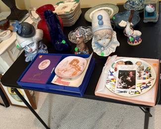 cybis and lladro pieces along with other plates and art pieces