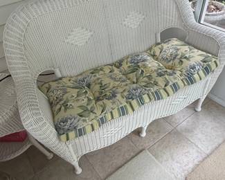 White Wicker Loveseat with Floral Cushion