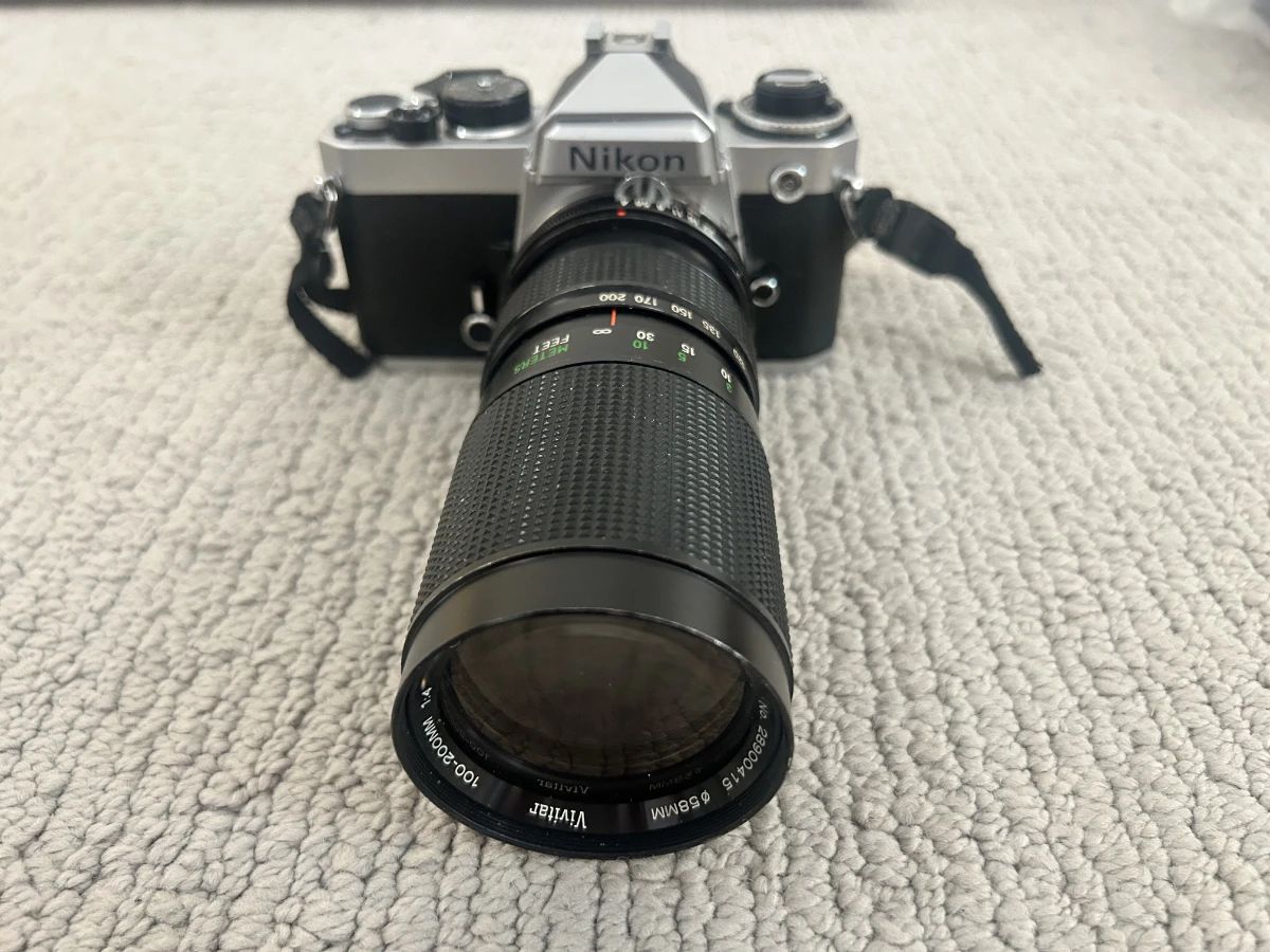 LOT 1Nikon FE3058507 Handheld Camera with Vivitar 100-200MM Lens Starting Bid $100.00