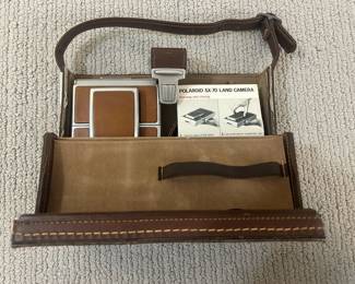 LOT 30 A Vintage and Almost Complete Polaroid SX-70 Land X Camera with Case and Accoutrements. Circa 1972-1981. Starting Bid $ 125.00