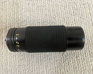 LOT 22 A Japanese Tokina 75-30MM Telescopic Lens . Number 9743227.Starting BID $35.00