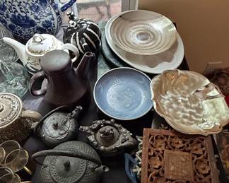 Assorted Asian-Inspired Teaware and Decorative Items, including Cast Iron Teapots and a Carved Wooden Panel