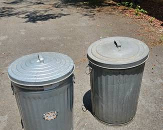 Metal trash cans all with lids