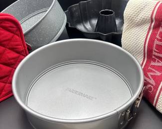Two Spring Pans And A Bundt Pan, 2 Red Pot Holders, 3 Dish Towels