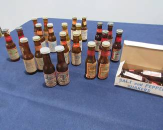 Several glass bottle salt and pepper shakers