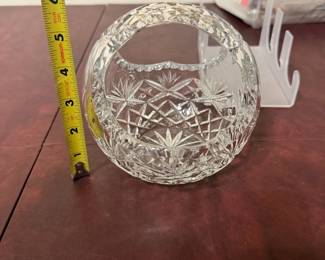 Cut Glass Crystal Covered Compote — Large cut glass crystal covered compote with a pedestal base and faceted lid, perfect for dining-room display or serving. The piece features deep vertical fluting and a starburst-style pedestal base; maker's mark etched BLOCK 10.5” tall (per seller). Overall height measures about 10.5 inches and the piece is clear crystal glass. In good condition with light surface wear and no obvious chips or cracks visible in photos. A classic elegant serving piece suitable for formal table settings or as a decorative centerpiece.