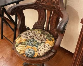 Wooden Carved Captain's Chair with Floral Upholstered Seat Cushion