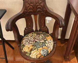 Wooden Carved Captain's Chair with Floral Upholstered Seat Cushion