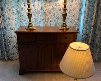 Wood Cabinet With Three Brass Table Lamps