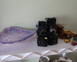 cameras ,toy cars, glass centerpiece
