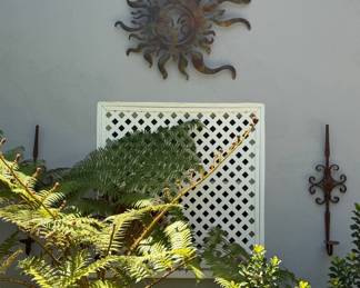 Metal Sun Sculpture and Wrought Iron Sconces