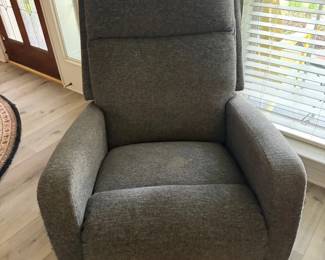 Gray Upholstered Recliner Chair with Pilling on Armrests