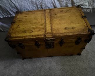 Antique Yellow Metal Flat Top Steamer Trunk