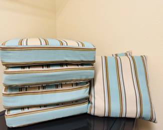 Refresh your outdoor living space with this beautifully coordinated collection of premium patio cushions and accent pillows. Featuring a sophisticated coastal palette of soft aqua, ivory, cinnamon, and subtle earth-tone stripes, this collection brings timeless Florida style to any lanai, patio, or poolside seating area.
