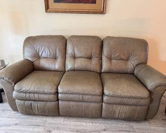 Relax in legendary La-Z-Boy comfort with this matching genuine leather reclining living room set. The collection includes a dual reclining sofa and a dual reclining loveseat, both featuring smooth manual reclining mechanisms, plush pillow-top arms, supportive high-back cushions, and generously padded seating.