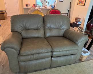 Relax in legendary La-Z-Boy comfort with this matching genuine leather reclining living room set. The collection includes a dual reclining sofa and a dual reclining loveseat, both featuring smooth manual reclining mechanisms, plush pillow-top arms, supportive high-back cushions, and generously padded seating.
